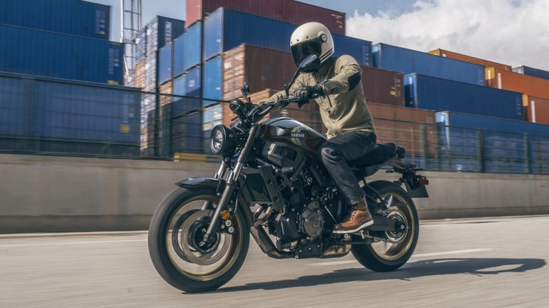 Yamaha XSR700 being ridden at a shipping yard