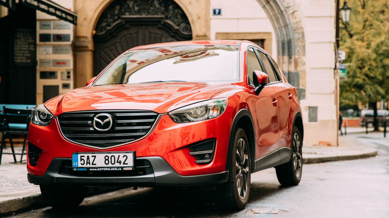 The front view of a 2017 Mazda CX-5 SUV finished here in a red colorway