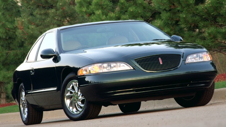 Black Mark VIII from front angle cruising up on a road