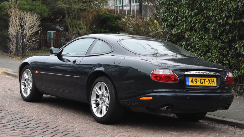Black Jaguar XK8 side and rear view with two doors