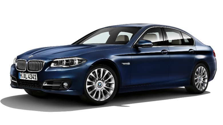 Royal blue BMW 550i in white background
