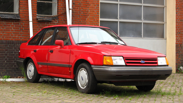 Front 3/4 shot of a red 1985-1990 Ford Escort.