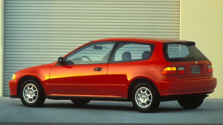 Rear 3/4 shot of a red 1992 Honda Civic VX hatchback.