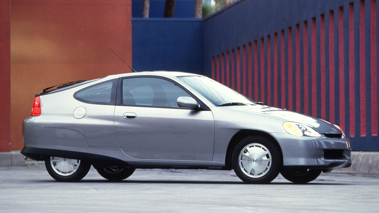 Side profile shot of a silver 2000 Honda Insight.
