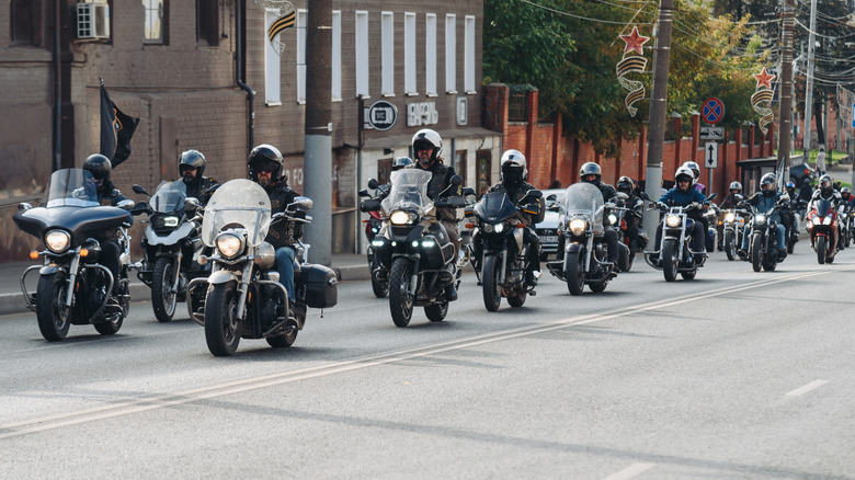A group of fully kitted out bikers taking part in a motorcycle parade