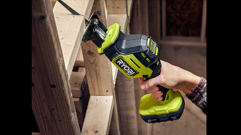 person cutting joist with sabre saw