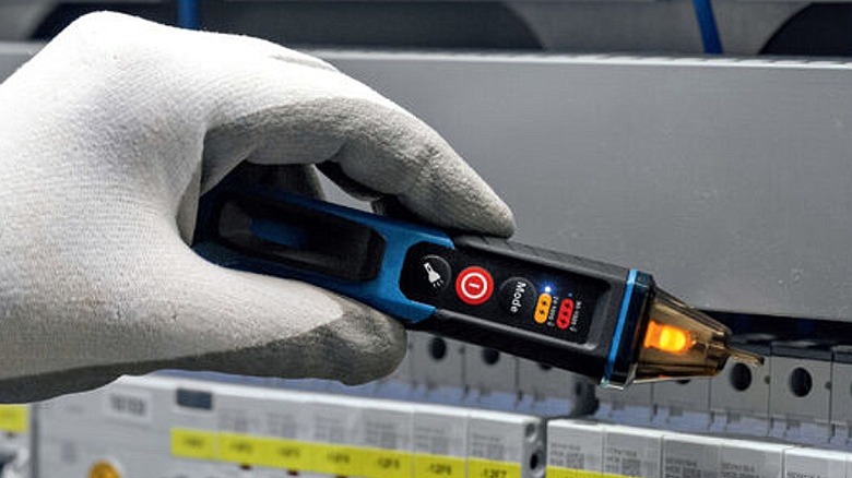 Obtaining voltage readings via a voltage tester.
