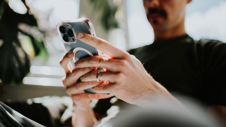A man holding an iPhone