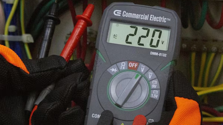 Commercial Electric pocket-size digital multi-meter displaying voltage