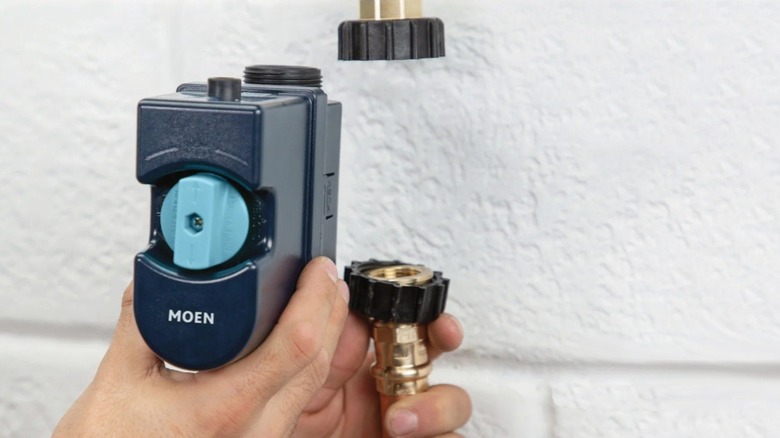 Smart water monitor being installed