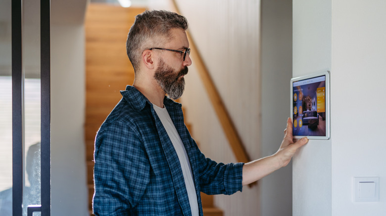 Man setting up smart home system