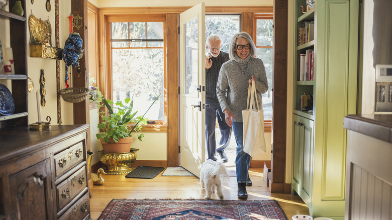 Elderly couple returning home