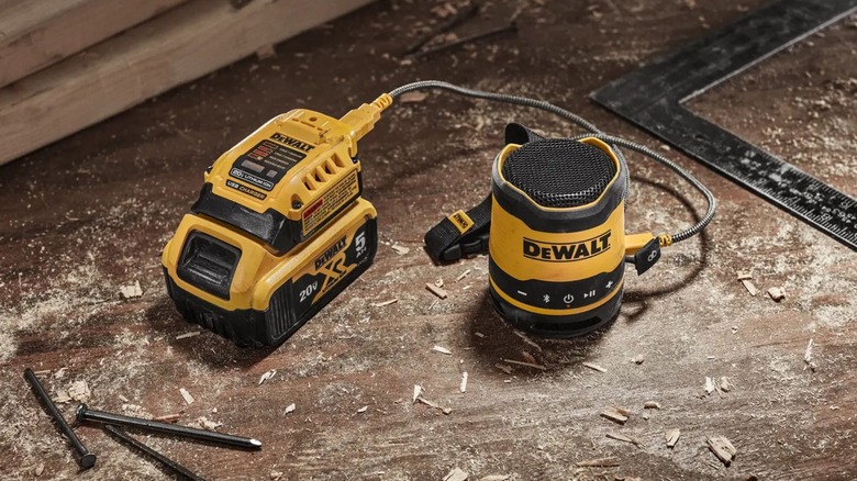 DeWalt Bluetooth Speaker on dirty jobsite floor