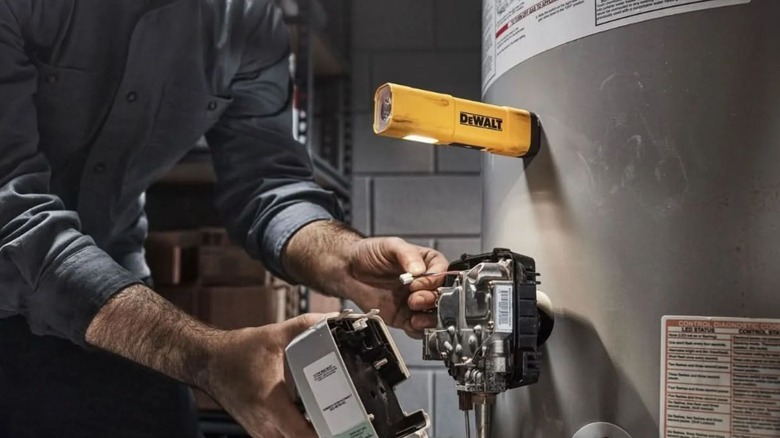 DeWalt Rechargeable Flashlight magnetically attached to water heater