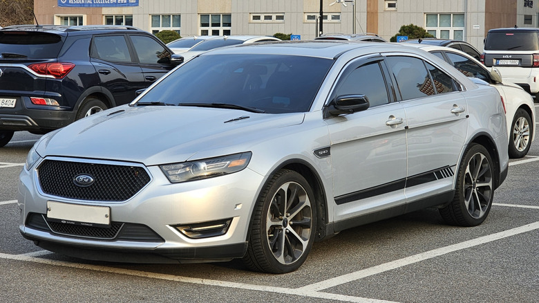 Ford Taurus sitting in a parking lot
