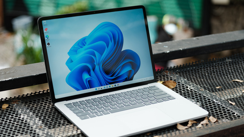 A Windows laptop kept on a metallic surface