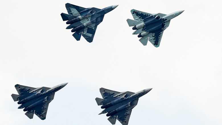 four Su-57s flying