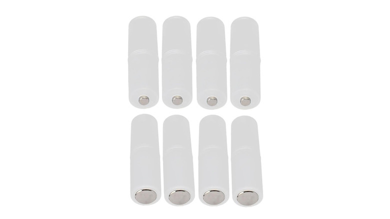 8 AAA to AA battery adapters on white background