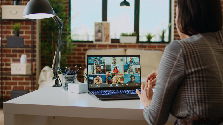 A person working from home on a meeting with colleagues