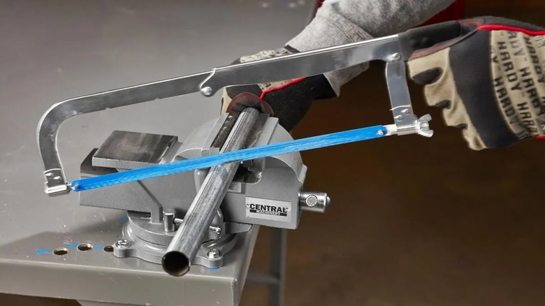 cutting a pipe with help from Central Machinery vise