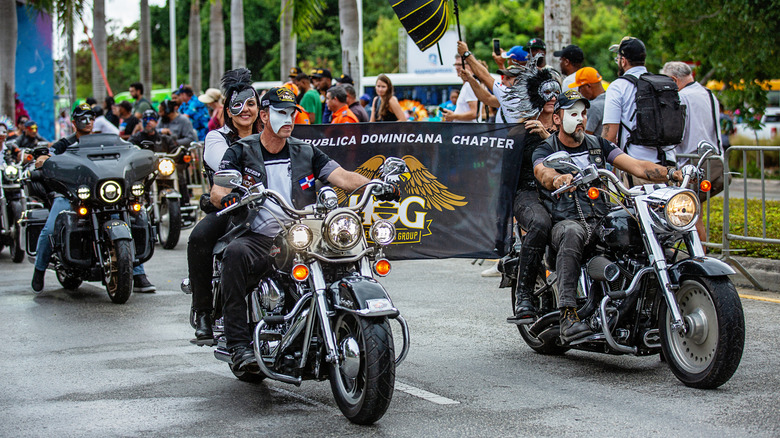 Several harley riders in full gear moving as part of an annual parade in Punta Cana