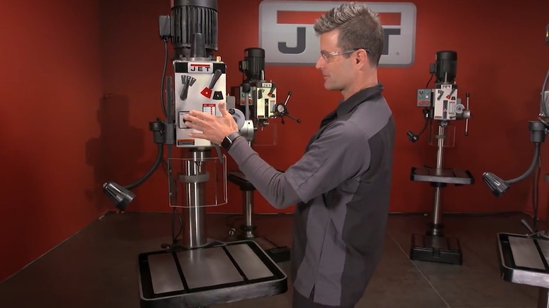 Person demonstrating Jet Tools drill presses