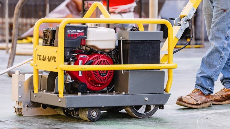 Close up of person using concrete saw