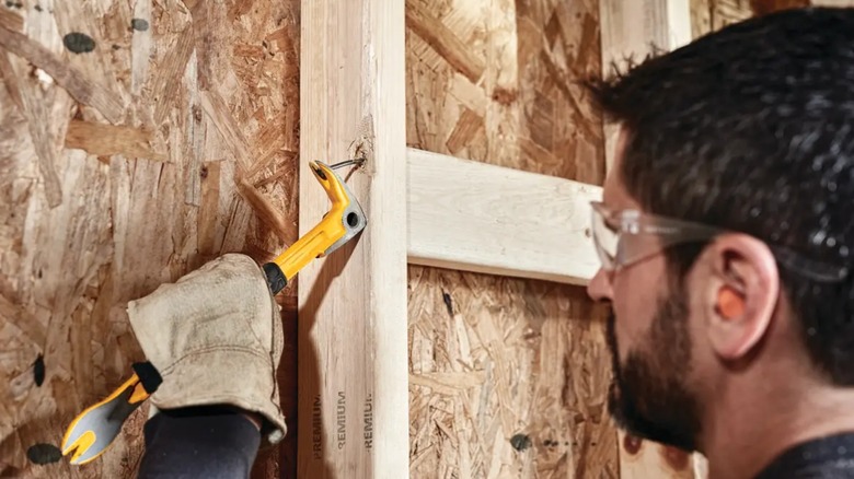 removing nail with claw bar