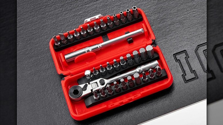 Mini toolbox consisting of ratchet and several bits.