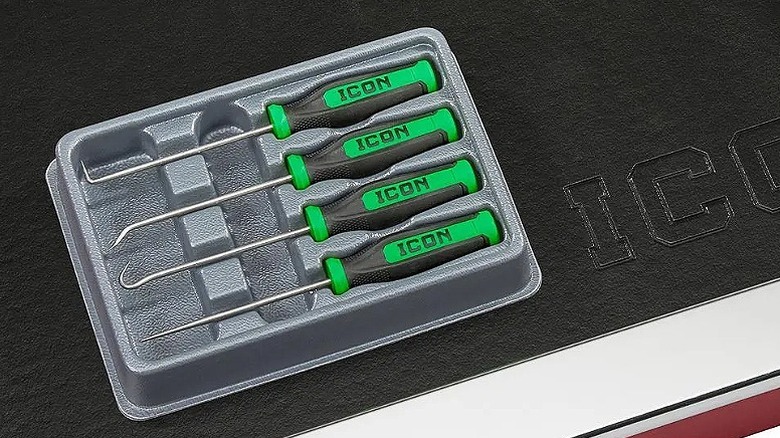 Four pick and hook pieces placed in a case.