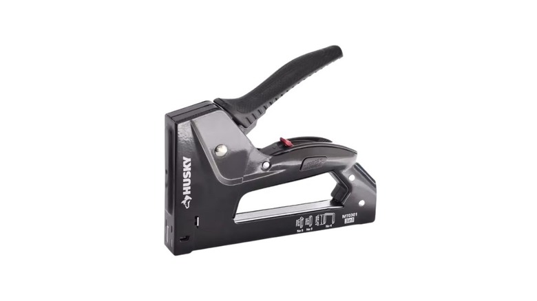 A black metal staple gun by Husky
