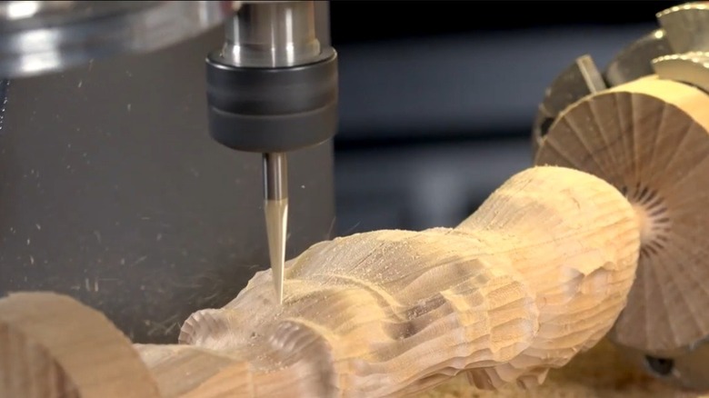 Close up of Axiom routing table carving wood