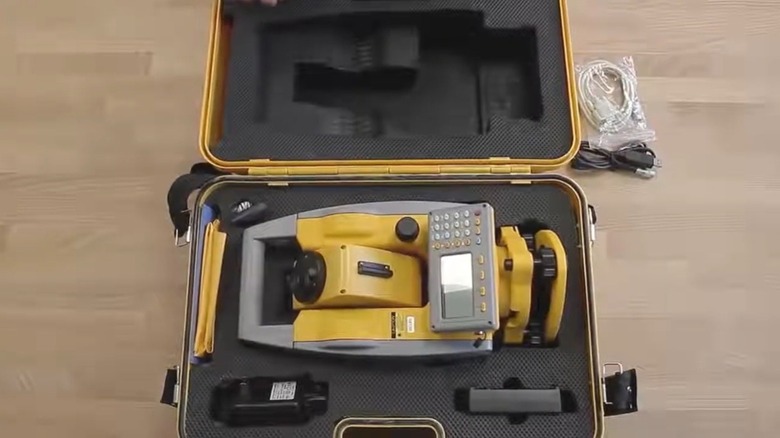 Person unboxing NWi total station