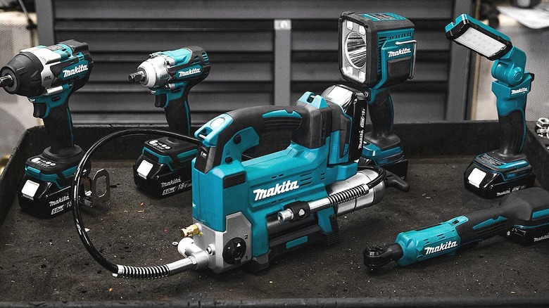 Several Makita power tools placed on a table.