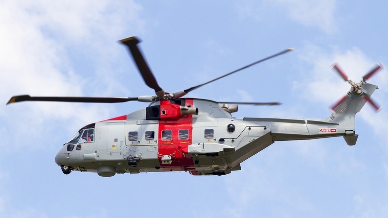 Algerian Navy AW101 helicopter flying against a blue sky
