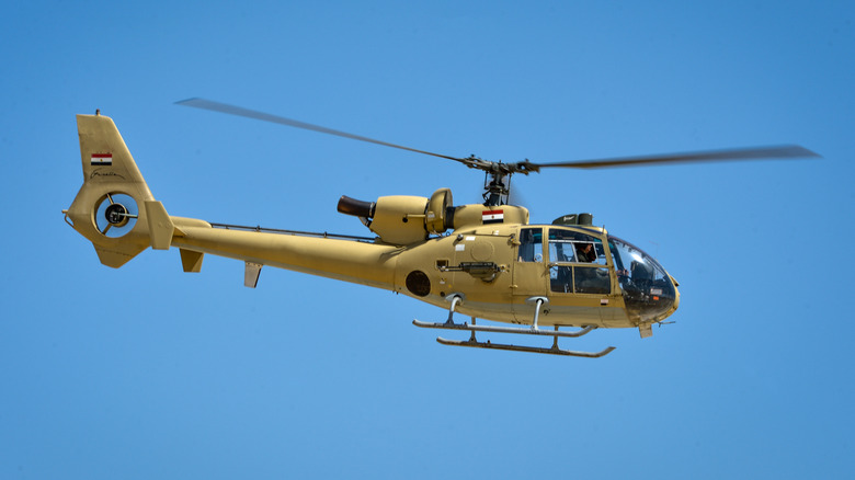 Egyptian Army Aérospatiale Gazelle hovering against a cloudless blue sky