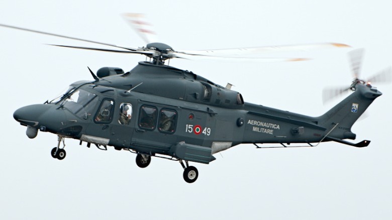 Italian Air Force AW139 in flight against a gray sky