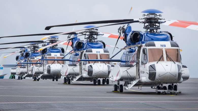 A row of Sikorsky S-61 helicopters on an oil rig