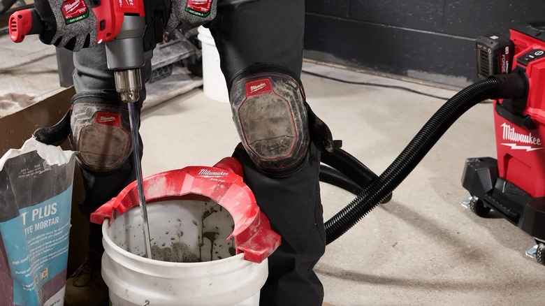 mixing mortar in a bucket with topper attached