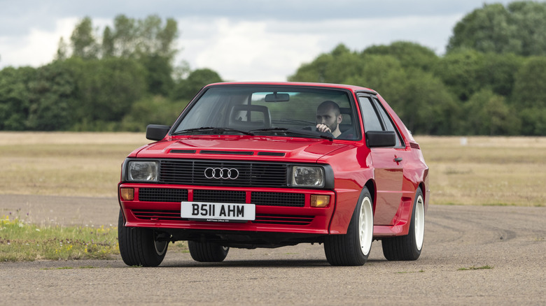 Audi Sport Quattro cornering on track front 3/4 view