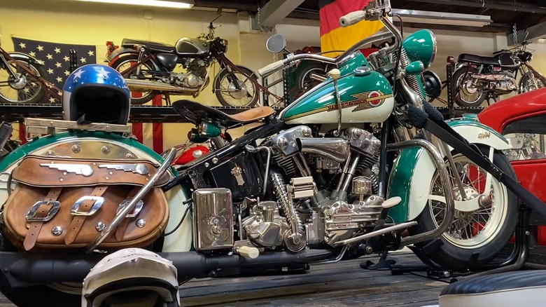 A grey and white Panhead Hydra Glide Harley on display at 20th century cycles