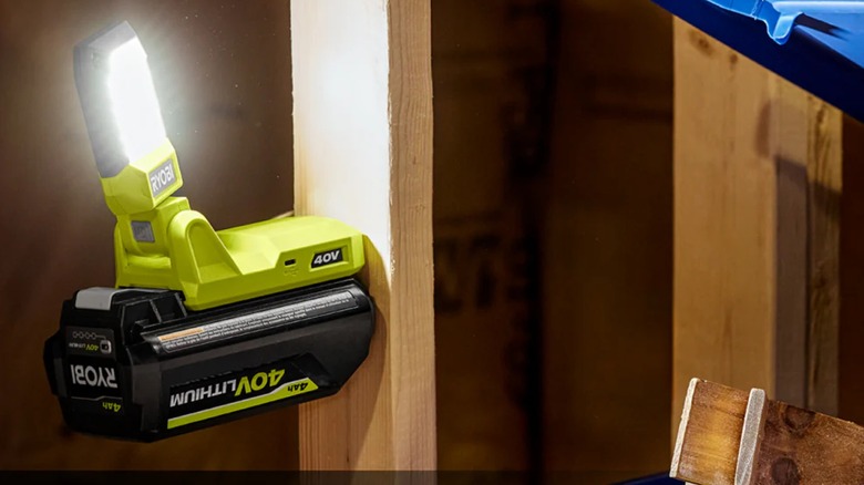 The 40V Battery Topper Light attached to a wooden plankl