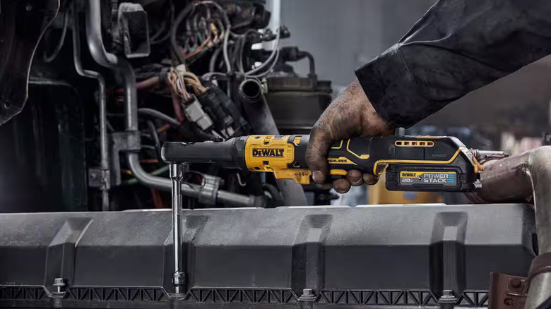 Worker using DeWalt cordless ratchet