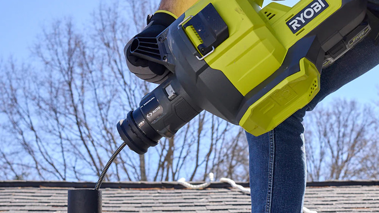 Ryobi 18V One+ Drain Auger clearing a drainpipe