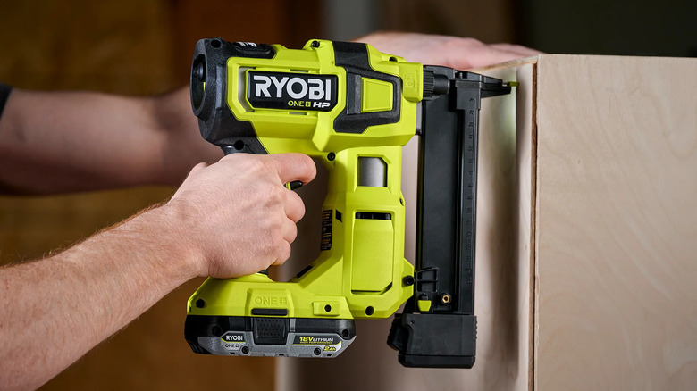 Man using Ryobi 18V One+ Stapler