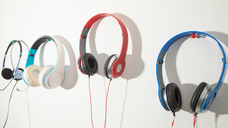 Headphones lined up on wall