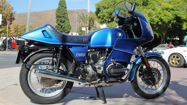 A metallic blue BMW R100 RS at an outdoor classic motorbike event