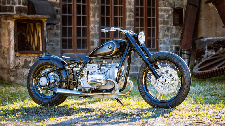 A navy blue and silver BMW R5 Hommage, the only one of its kind in the world, in front of an old warehouse