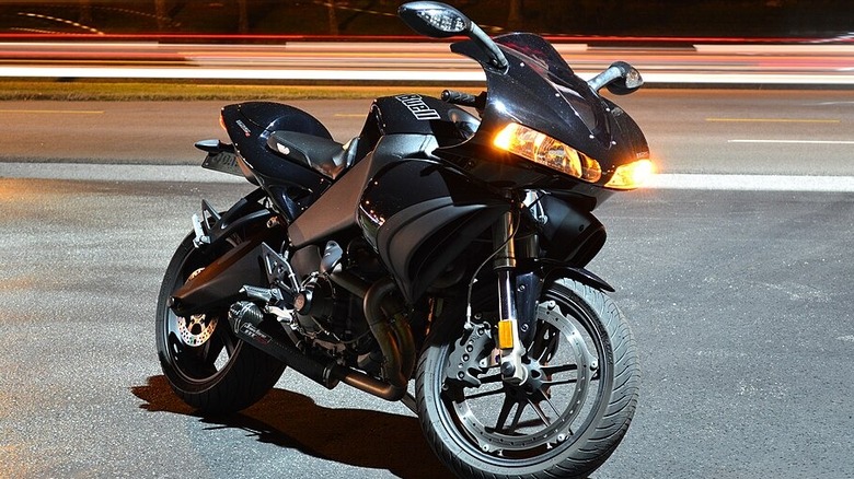 A jet black Buell 1125 R in the resting position on pavement