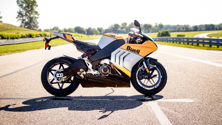 Yellow and black Buell Hammerhead 1190 in the middle of a track during a sunny day